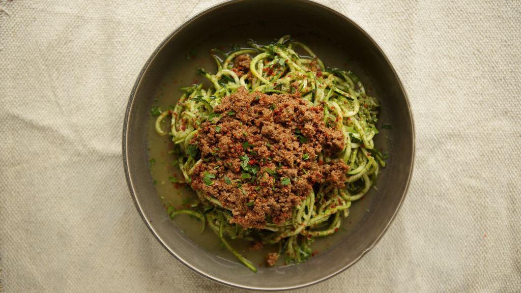 Ground Beef Pesto Zoodle · Zucchini spaghetti with homemade pesto sauce, ground beef and Parmesan. Gluten free.