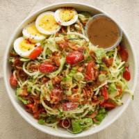 Zoodle Cobb Salad · Zucchini spaghetti, bacon, egg, avocado, tomato, green onion, Parmesan with balsamic dressin...