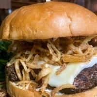 Brie Burger · 6oz burger topped with truffle oil, roasted garlic aioli & sweet fried onions served with a ...