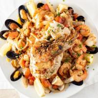 Mariscada · Seafood platter with calamari, shrimp, jumbo tiger shrimp, clams, mussels, and snapper.