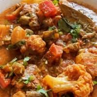 Vegetable Curry · Mixed vegetables cooked with ground spices and curry sauce.