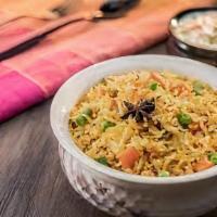 Vegetable Biryani · Saffron scented rice with mixed vegetables.