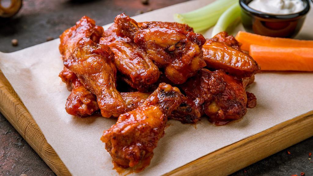 The Classic Hot Wings · Hot N' Crispy Chicken wings, tossed in a house special Hot sauce and fried to perfection!