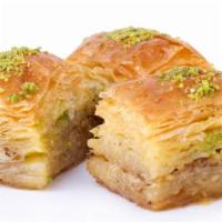 Pistachio Baklava · Two pieces of famous Mediterranean flavored dessert with pistachios and nuts.