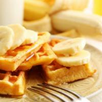 Cheeky Monkey Waffle  · Sweet Waffle with banana, peanut butter sauce topped with whipped cream.