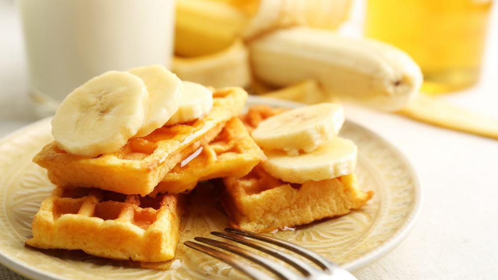 Cheeky Monkey Waffle  · Sweet Waffle with banana, peanut butter sauce topped with whipped cream.