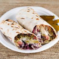 Falafel Wrap (VEGAN) · Falafel, hummus, red and white cabbage,  pickles, and tomatoes, topped with tahini sauce on ...