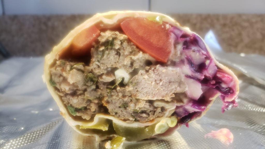 Kefta Kabob Wrap · Kefta kabob (minced  lamb & beef), grilled tomatoes, seasoned onions, parsley, pickles,  white cabbage, with tahini & hot sauce if desired on lavash bread