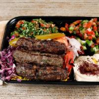 Kefta Kabob Plate · Kefta kabob skewer (LAMB & BEEF)  served with tabouli, jerusalem salad, rice, hummus, grille...