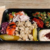 Chicken Shawarma plate · Thinly sliced chicken shawarma with tabouli, jerusalem salad, rice, hummus, grilled tomatoes...