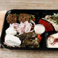 Vegetarian Combo Plate · Falafel, hummus, tabouli, jerusalem salad, baba ganoush, 2 dolmas, feta cheese, and tahini s...