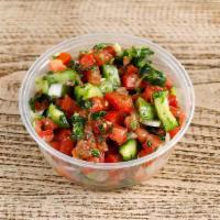 Jerusalem Salad ( VEGAN & GLUTEN FREE) · Tomatoes, cucumber, onions, mint, and parsley mixed olive oil salad dressing.