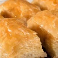Walnut Baklava · Buttered layers of phyllo dough, walnut filling, and sweet syrup.