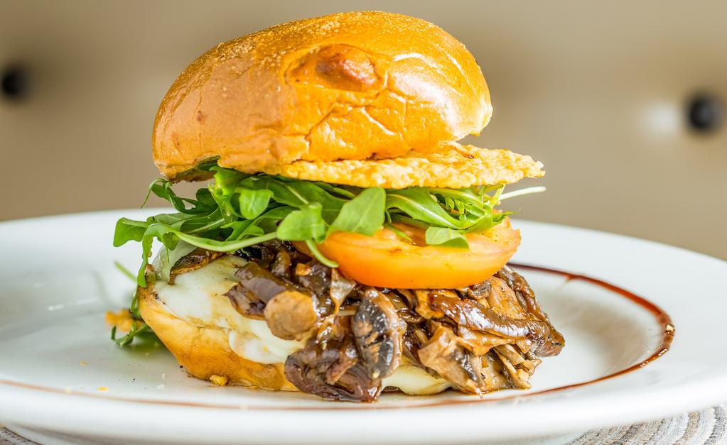 Montclair Burger · Provolone, truffle miso aioli, sauteed mushroom, grilled tomato, caramelized onion, organic arugula and Parmesan crisp with toasted artisan brioche bun. Served with side tomato, red onion and lettuce.