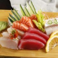 Sashimi Combo · 12 pieces of assorted sashimi served with rice and soup.