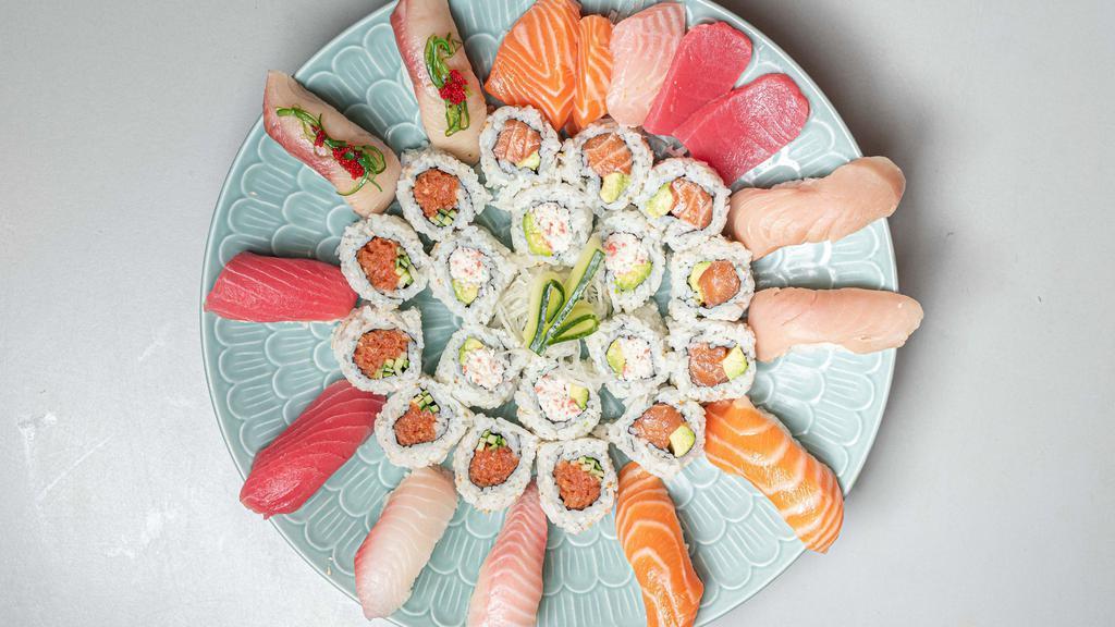 Super Sushi Combo (for 2) · 8 pieces of assorted sushi, 6 pieces spicy tuna roll, 5 pieces sashimi, 6 pieces California roll and 6 pieces sake maki.