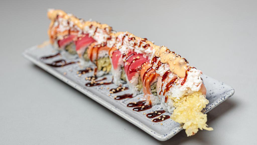 Snow Dragon Roll · Shrimp tempura inside with crab meat, tuna, and salmon on top.