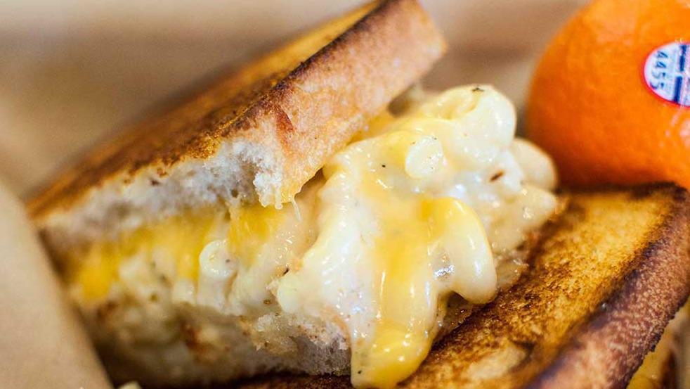 Mac and Cheese Grilled Cheese · Mac n cheese stuffed into a garlic buttered grilled cheese on sourdough (vt) .