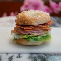 #29. Club Sandwich · Turkey breast, ham, bacon, cheese, lettuce, tomato, cucumber, mustards and mayo.