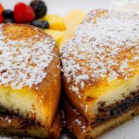 Le Parisien · French toast stuffed with chocolate hazelnut spread and banana served with fruit