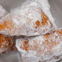 BEIGNETS · Deep fried dough topped with powder sugar