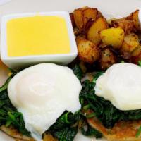 La Florentine · Poached eggs with sliced tomato, spinach and hollandaise sauce.