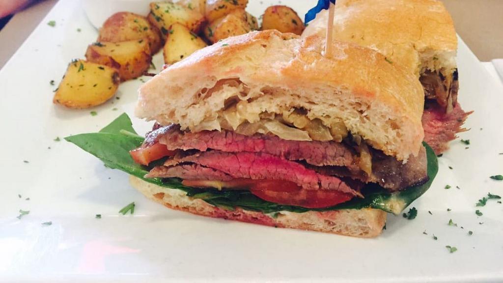 Sandwich Au Steak Grille · Grilled flank steak with baby spinach, grilled onions and gorgonzola sauce.