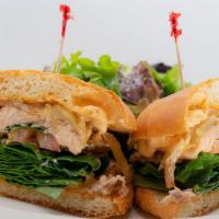 Sandwich Au Saumon Grille · Grilled salmon with baby spinach, grilled onions and tartar sauce.
