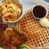 Fried Buttermilk Chicken, Waffle with 2 Eggs · Fried buttermilk chicken and waffle with 2 poached eggs, with butter syrup.