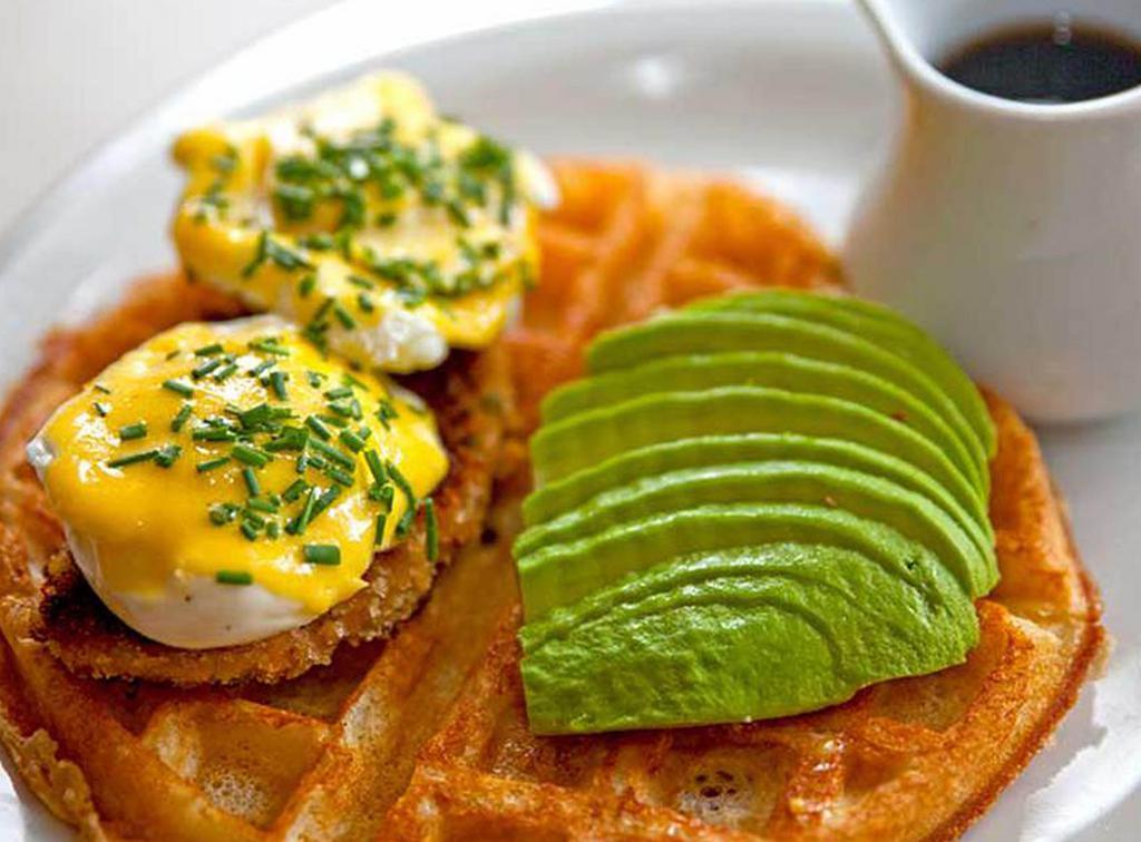 Loaded Waffle with Two Eggs · Comes with two eggs your way (Options as: sunny
side, over easy, over hard, scrambled,
and poached), 
crab cake, roasted pepper mayo, home fries, and avocado. Served with syrup.