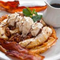 Louise Waffle · Bananas foster walnuts  with Nutella, caramel and Bacon. Served with syrup
