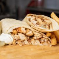 Chicken Shawarma meal · Shawarma seasoned chicken in creamy garlic sauce, pickles and fries. With large fries