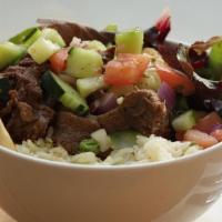 Firecracker Beef Bowl · Tender beef bourguignon, jasmine rice, organic mixed greens, red onions, Mediterranean salad...