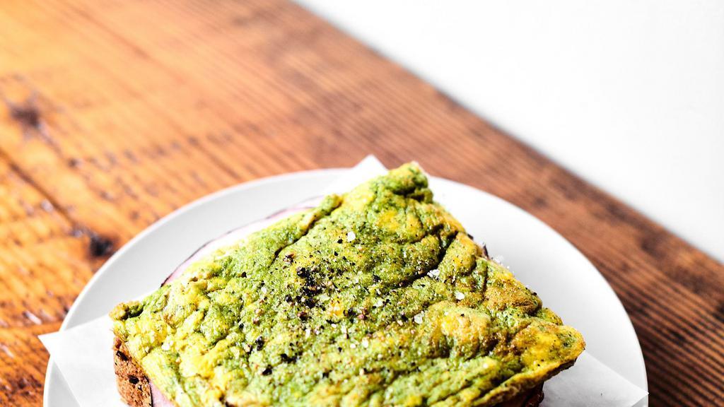 Green Eggs + Ham · 2 Eggs Scrambled with Pesto and slices of Ham