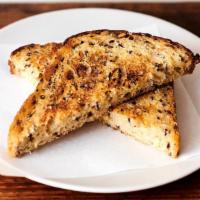 Plain with Salted Butter · Thick-Cut-Seeded-Sourdough Toasted With Butter