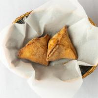 Vegetable Samosa · Crispy patties stuffed with potatoes and peas with mild aromatic spices.