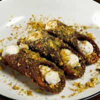 Cannoli · topped with chocolate and pistachios