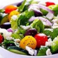 Greek Salad · Lettuce, Olives, Tomatoes, Cucumbers, Onions, Cheese and Tzatziki Sauce.