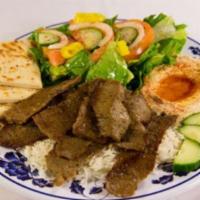 Gyro Platter · Gyro (Lamb+Beef), Salad, Rice, Hummus, Pita Bread with Side of Tazitki and Spicy Sauces.