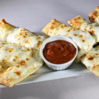 Pizza Sticks · Our best ever tasted appetizer, fresh made thick bread with creamy white sauce and lots of c...