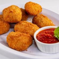 Jalapeño Poppers · Eight breaded jalapeño peppers filled with Cheddar cheese and golden deep fried served with ...