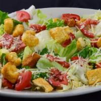 Caesar Salad (Individual Size - Serves 1-2) · Vegetarian. Hearts of romain, tomatoes, garlic croutons, Parmesan cheese and Caesar dressing.