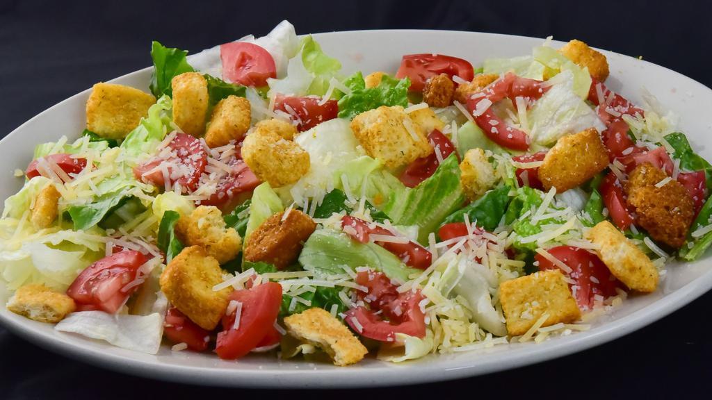 Caesar Salad (Individual Size - Serves 1-2) · Vegetarian. Hearts of romain, tomatoes, garlic croutons, Parmesan cheese and Caesar dressing.