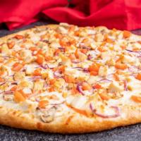 Chicken Deluxe · Chicken breast, red onions, mushrooms, garlic, and tomatoes over creamy white sauce.
