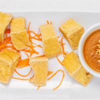Golden Fried Tofu · Crispy tofu served with peanut dipping sauce.