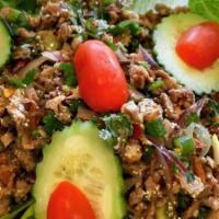 Larb · Spicy. Choice of ground meat with spices, herbs, roast rice powder, mint, romaine lettuce wi...