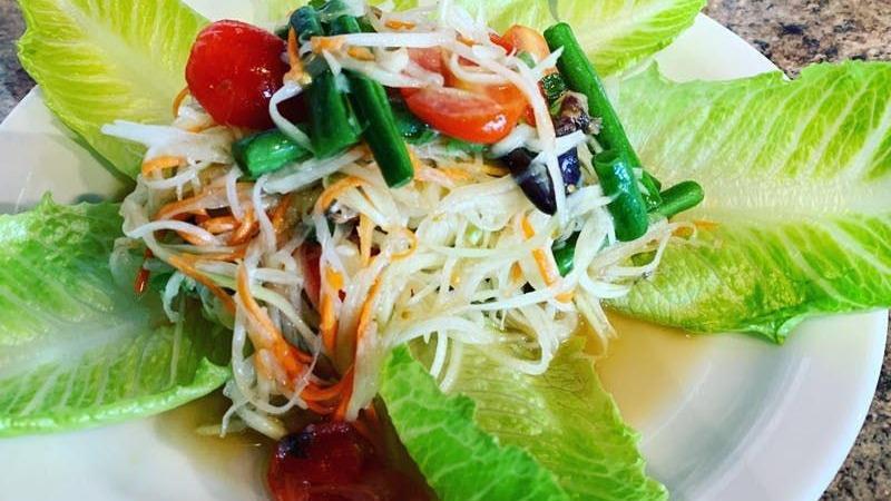 Papaya Salad · Spicy. Thai style salad with shredded green papaya, green bean, cherry tomato, carrot, and ground peanut, with homemade lime dressing with fish sauce.