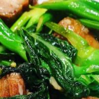 Pad Kana Moo Krob · Spicy. Golden crispy pork belly stir-fried with Chinese broccoli, garlic, and chili. (Season...