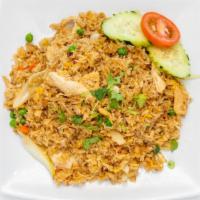 Thai Fried Rice · Pan-fried Rice with egg, onion, carrot, peas, and choice of protein with cucumber, tomatoes,...