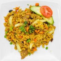 Pineapple Fried Rice · Pan-Fried Rice with curry powder, egg, onion, pineapple chunk, raisin, cashew nut, carrot, p...
